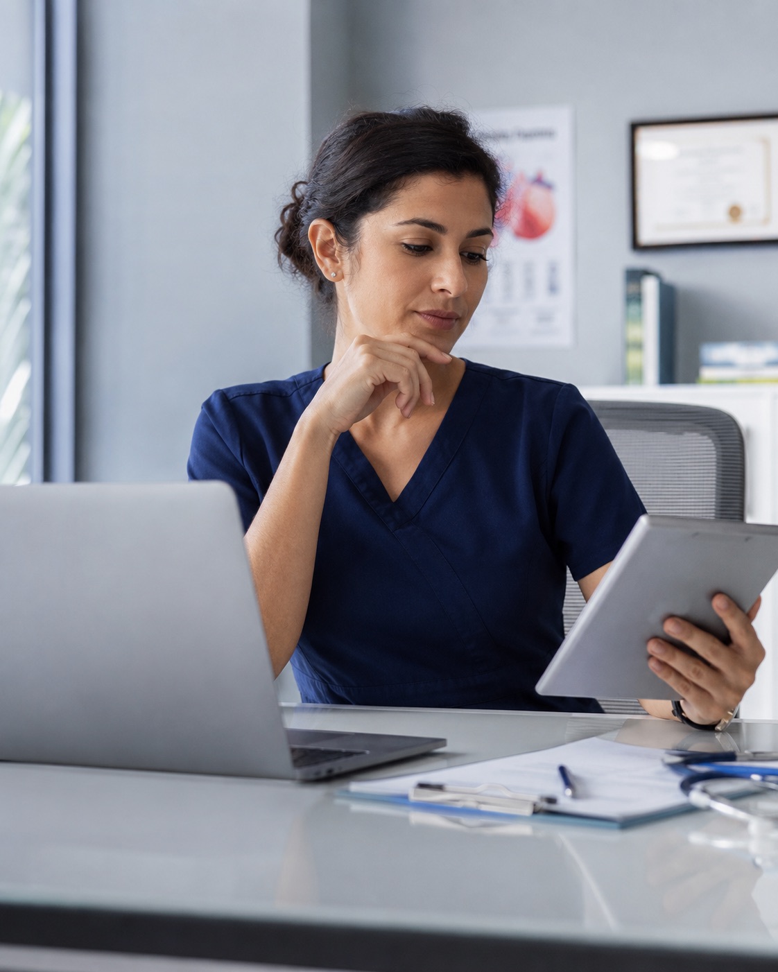 Doctor reviewing patient bloodwork on a laptop in a calm clinical setting